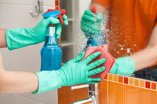 Builders cleaning after renovation in a SW5 flat